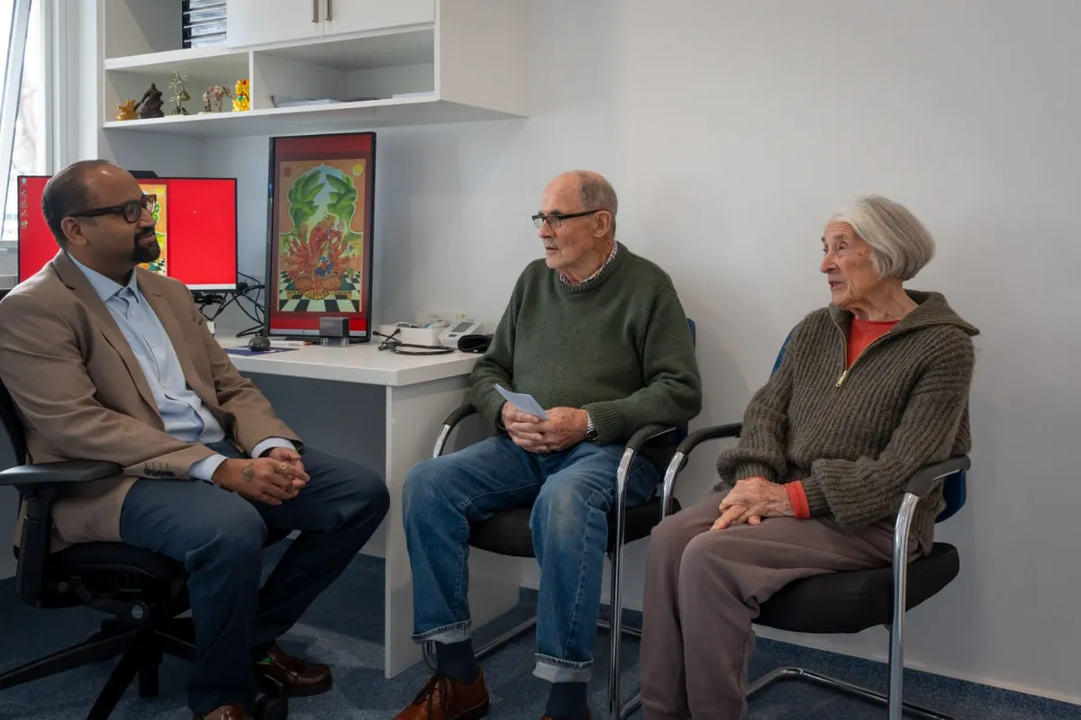 A GP in conversation with two older patients at Thorpe Street Health