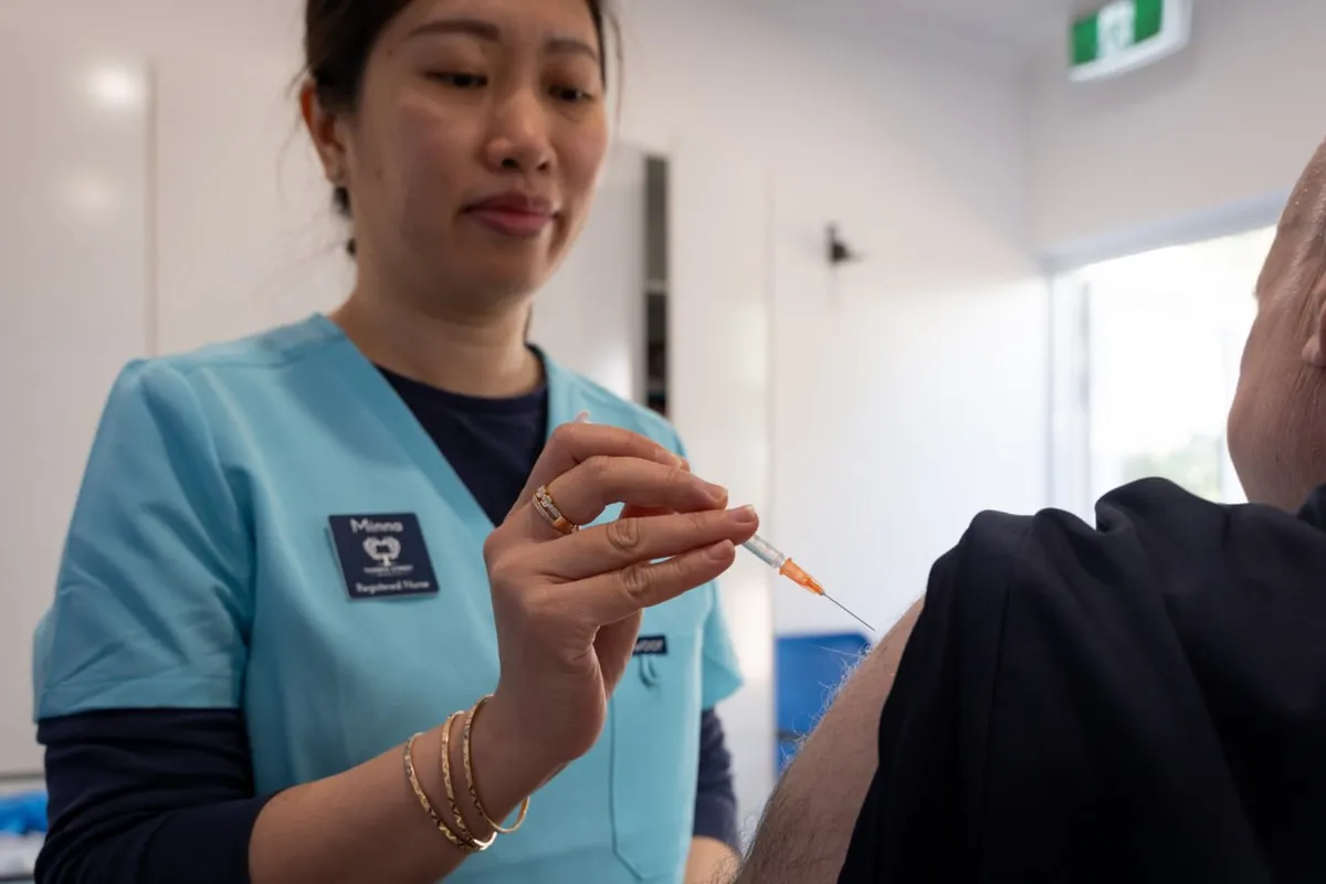A practice nurse preparing a vaccination at Thorpe Street Health