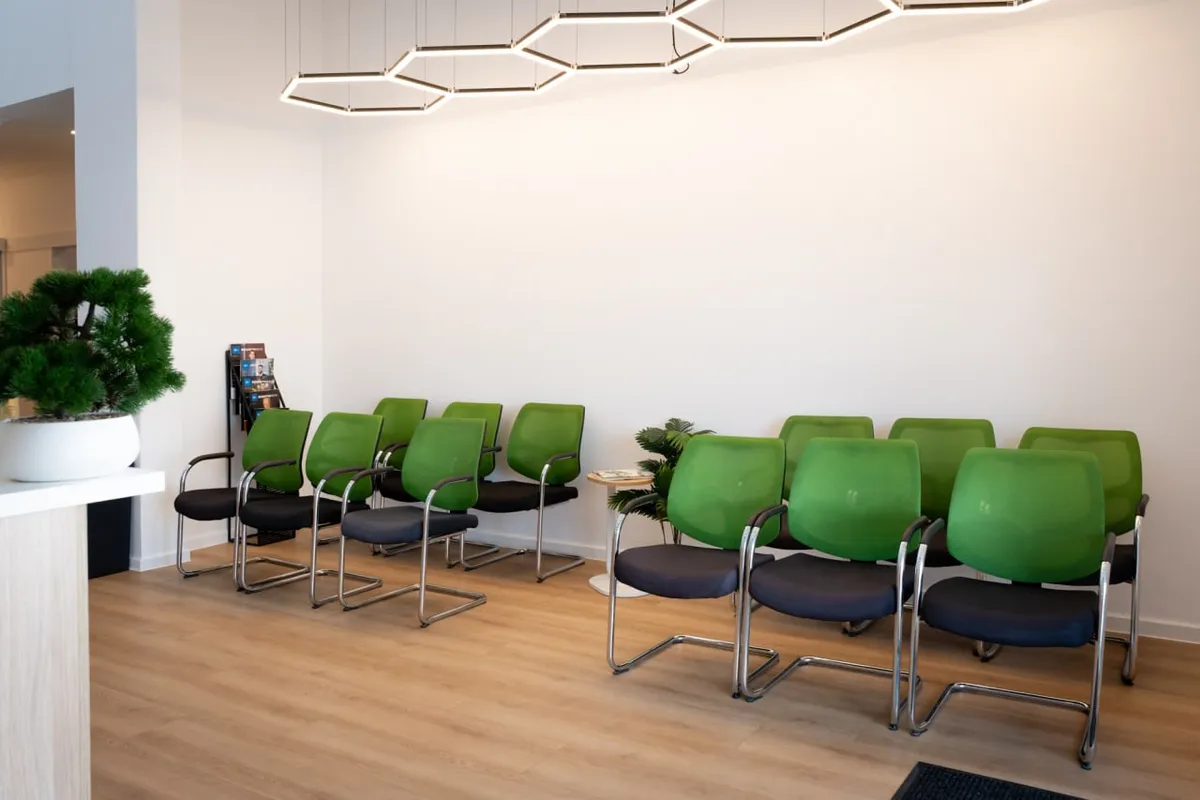 The waiting room at Thorpe Street Health, under its hexagon light fitting